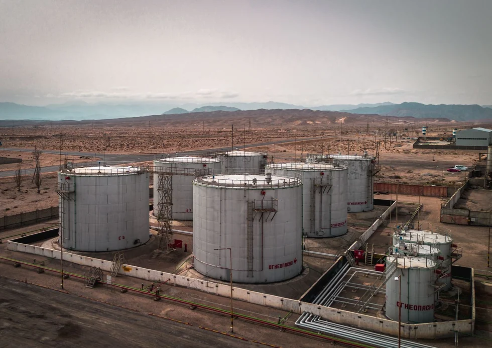 Home Oil and gas tank farm with pipework in arid terrain